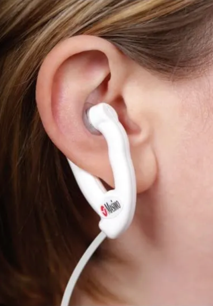 Picture of a Masimo 4015 RD E1 Adhesive Ear Sensor on a patient's ear.