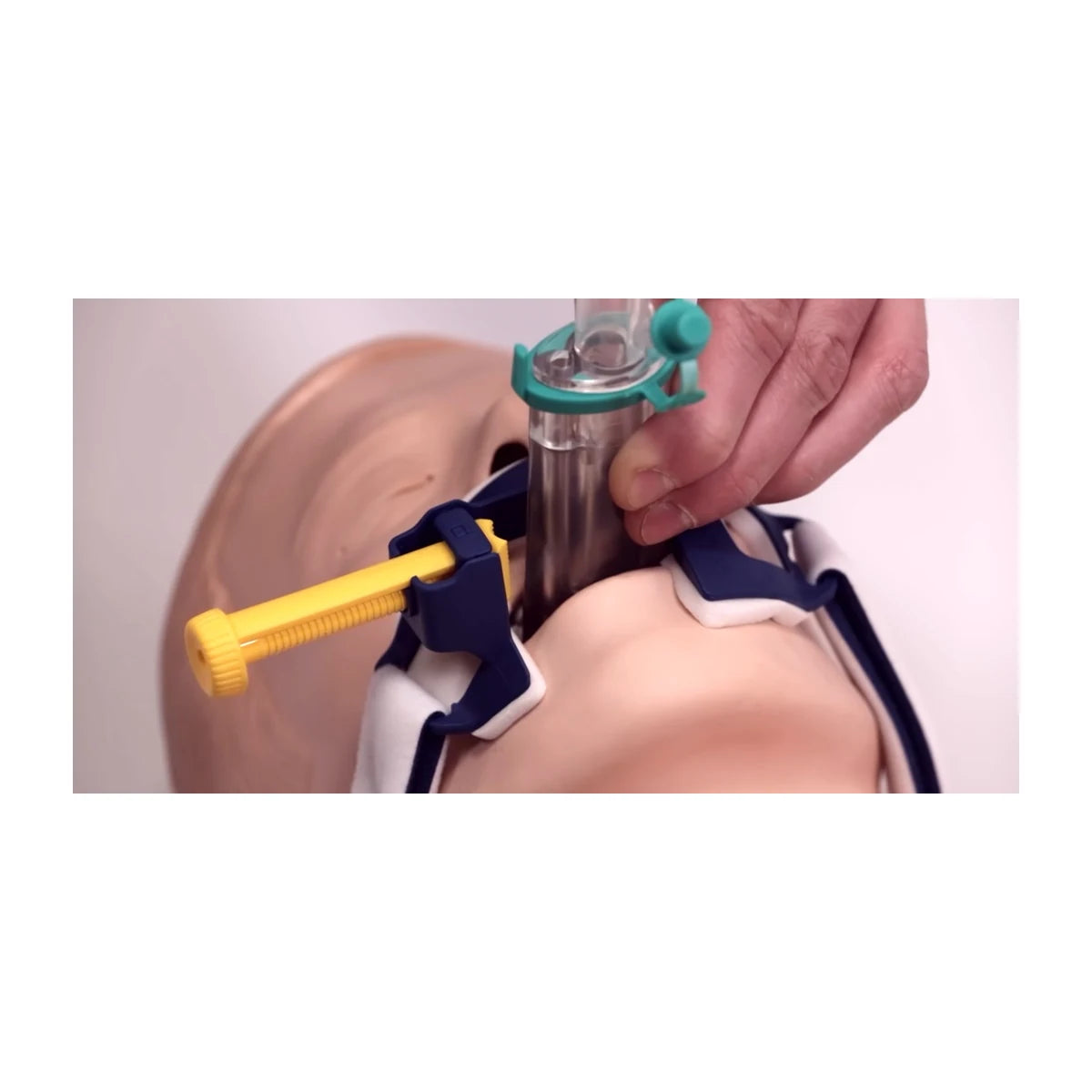 Laerdal Thomas Select tube holder 600-42500 clamping an i-gel supraglottic airway on an adult airway manikin - Pacific Biomedical