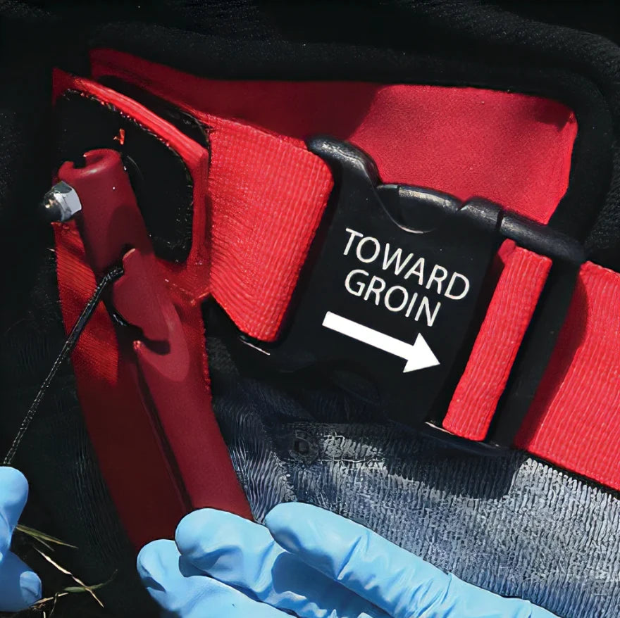 Red groin strap buckle on Slishman Traction Splint