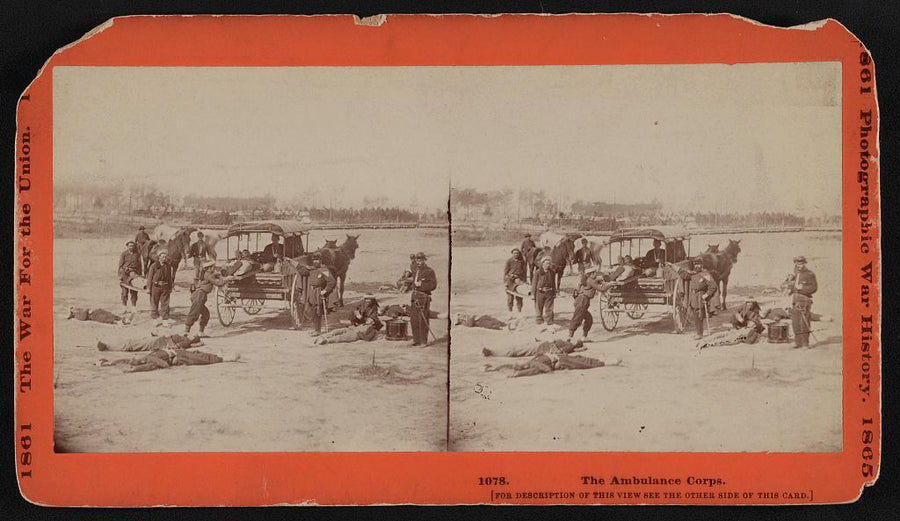 Civil War ambulance corps loading wounded onto horse-drawn ambulance