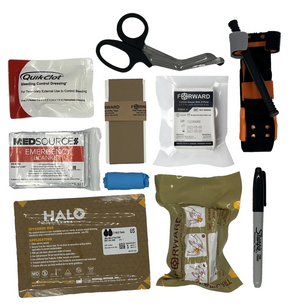 ME-FAK Plus contents laid out: QuikClot bleeding control dressing (Plus only), SAM XT tourniquet, HALO seals, FORWARD dressing and gauze, shears, blanket, tape, gloves, marker - Pacific Biomedical