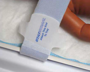 Statstrap point of securement to the neonatal isolette or incubator tray. Comparable to International Biomed Infant Straps.